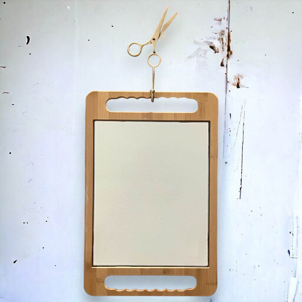 The eco-friendly bamboo mirror in caramel just hanging stylish on out custom scissor brass hook in gold.