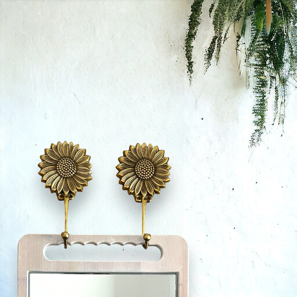 Golden sunflower brass hooks to hang your bamboo mirror on.