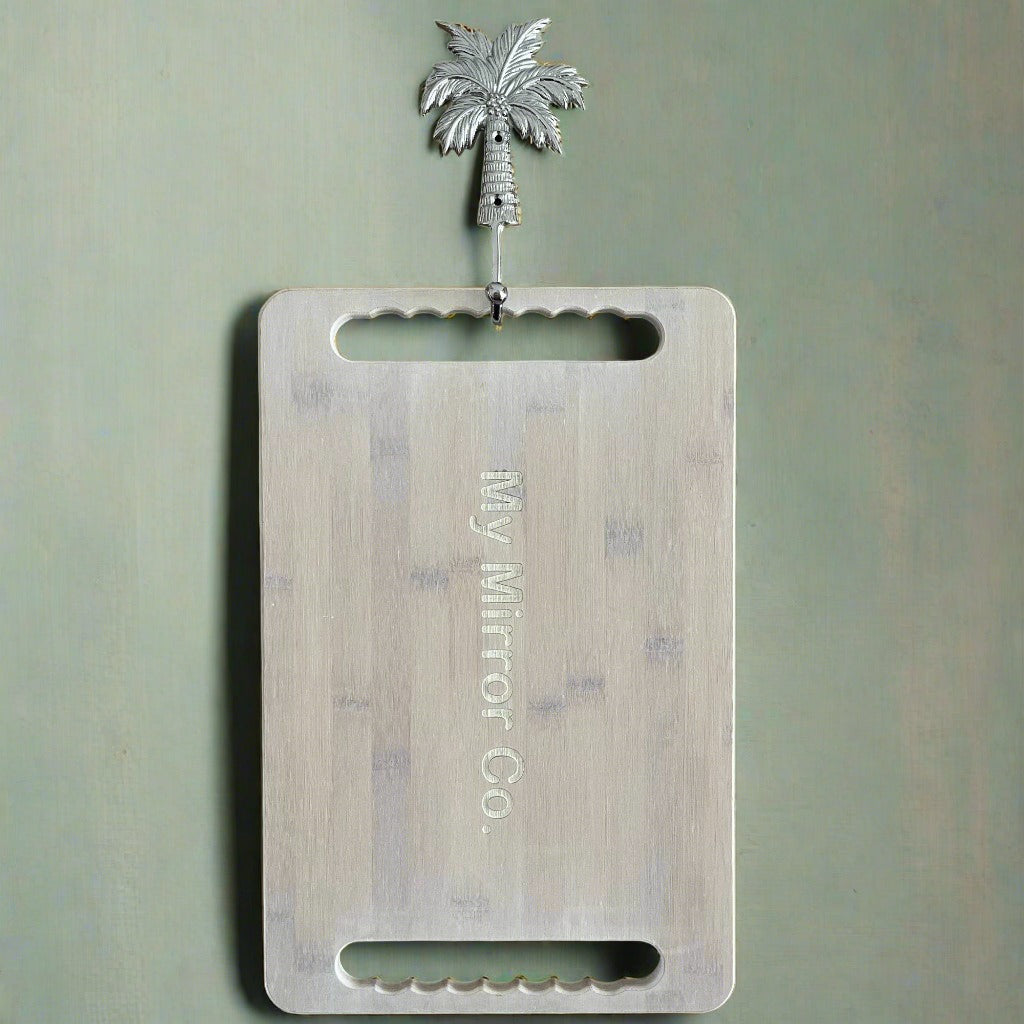 Hang your bamboo mirror in style with the palm tree brass hook in silver.