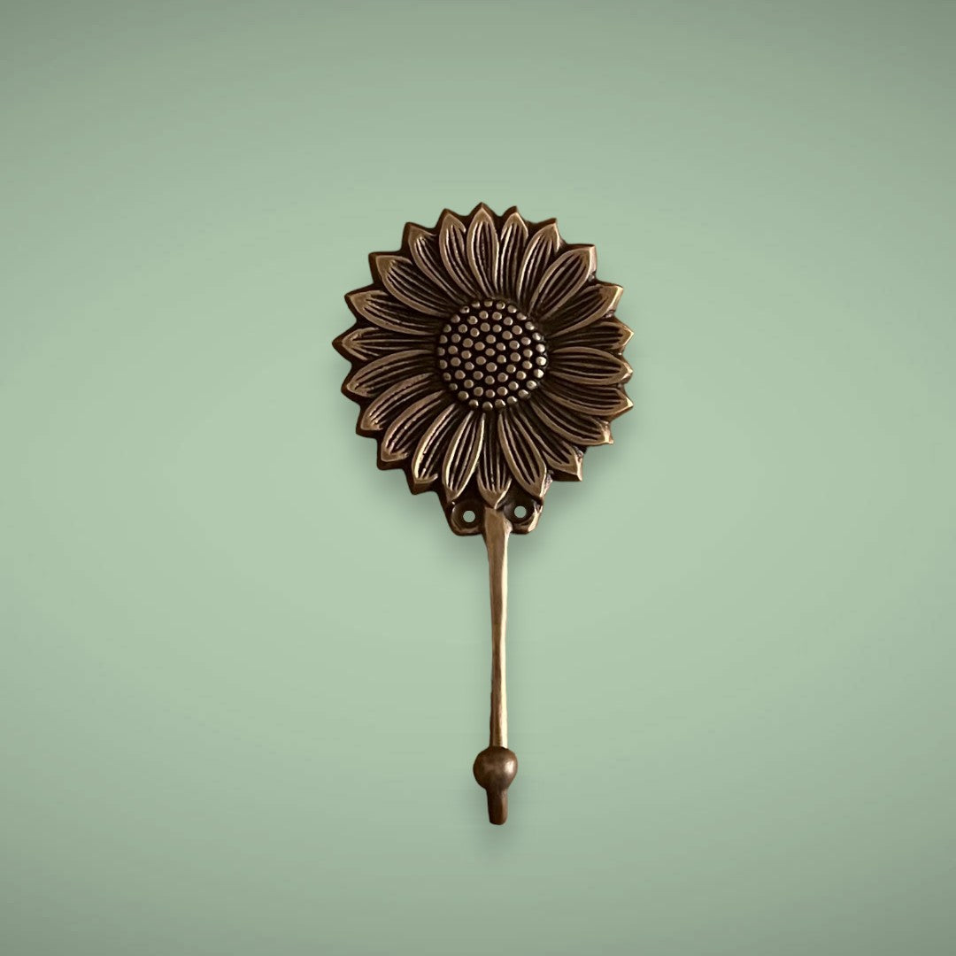 Happy days with our antique sunflower brass hook