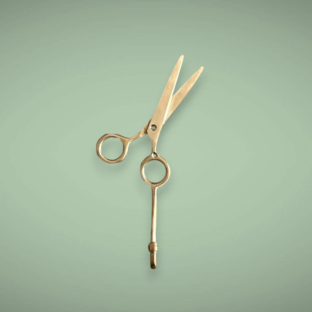 Hang your equipment on our golden scissors as a brass hook. 