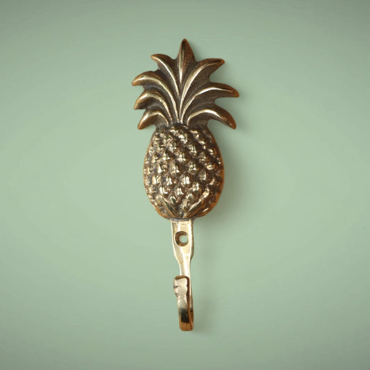 Pineapple brass hook in gold.