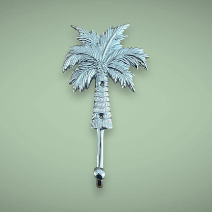 The brass hook in silver, palm tree style.