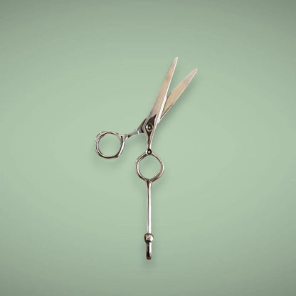 Our silver brass hook in the shape of scissors is perfect to hang your hair equipment on.